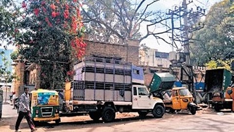Tipper vans parked outside the Government Telugu High School in Tasker Town, Shivajinagar.