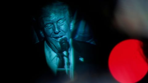 Seen through a viewfinder, US President Donald Trump speaks at the Detroit Economic Club on Tuesday, Jan. 13, 2026, in Detroit.
