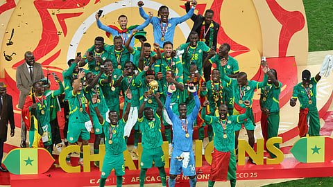 Senegal's Sadio Mane holds the trophy aloft as he celebrates with teammates after winning the Africa Cup of Nations final soccer match between Senegal and Morocco in Rabat, Morocco, Sunday, Jan. 18, 2026.