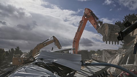 Israeli bulldozers demolish a UNRWA compound, belonging to the U.N. agency that assists Palestinian refugees, in east Jerusalem