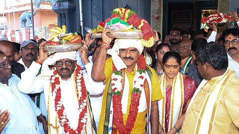 Minister dr nimmala ramanaidu couple offering silk clothes to goddess vasavi kanyaka parameswari matha at vasavi penugonda town in West Godavari.