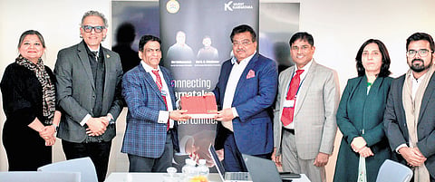 Large and Medium Industries Minister M B Patil with Shri Raju Vegesna, Chairman and Managing Director of Sify Technologies in Davos on Wednesday.