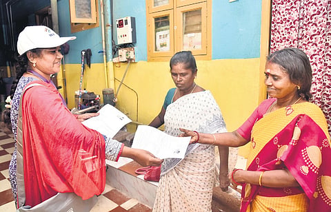 BLOs distributing SIR forms in Chennai during the enumeration phase.