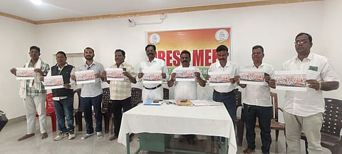 Congress leaders with the picture of Government advocates formally joining the BJP in Malkangiri on Sunday.