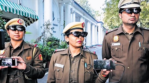 Delhi Police personnel wearing AI glasses during a demonstration on Thursday