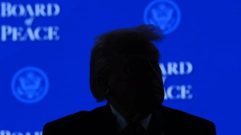 US President Donald Trump listens to speakers after the signing of a Board of Peace charter during the Annual Meeting of the World Economic Forum in Davos, Switzerland, Thursday, Jan. 22, 2026.