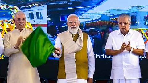 Prime Minister Narendra Modi, centre, Kerala Governor Rajendra Arlekar, left, and Chief Minister Pinarayi Vijayan during the launch of various developmental projects and flagging off of new train services, in Thiruvananthapuram.