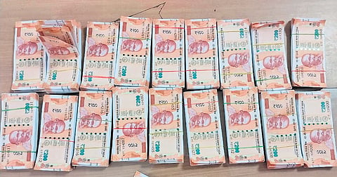GRP and RPF arrested two persons for carrying counterfeit Rs 200 currency notes at Visakhapatnam railway station on Thursday.