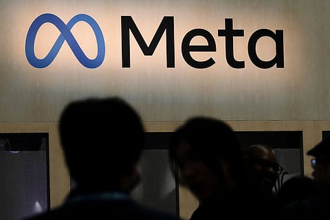 Attendees visit the Meta booth at the Game Developers Conference 2023 in San Francisco on March 22, 2023
