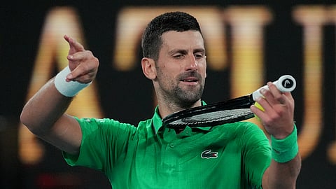 Novak Djokovic of Serbia reacts after defeating Botic van de Zandschulp of the Netherlands in their third round match at the Australian Open tennis championship in Melbourne, Australia, Saturday, Jan. 24, 2026.