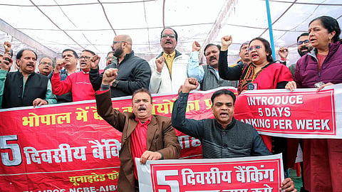 Bank employees, under the banner of the United Forum of Bank Unions (UFBU), protest demanding the implementation of a five-day banking week in Bhopal.