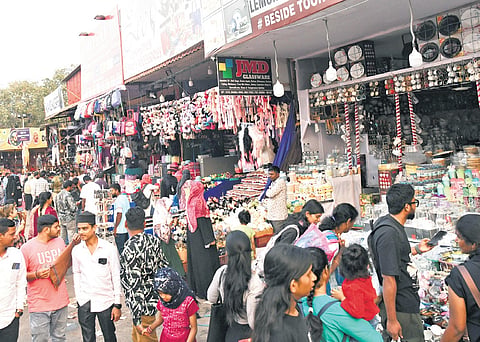 People browse at stalls and make purchases at Numaish in Hyderabad