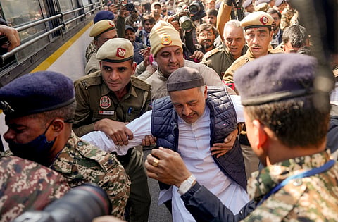 AICC in-charge of Delhi Qazi Mohammad Nizamuddin being detained during a protest rally organised under the 'MGNREGA Bachao Sangram', in New Delhi, Friday, Jan. 30, 2026.