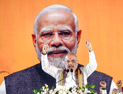 Union Home Minister Amit Shah addresses a gathering during BJP workers' meeting, at Barrackpore in North 24 Parganas district, West Bengal, Saturday, Jan. 31, 2026.