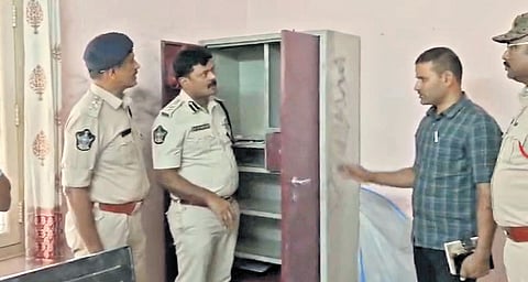 Vizianagaram SP Damodar inspects Dr Nagesh’s house in GMR township.