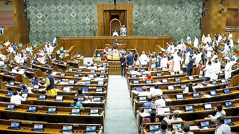 Opposition MPs protest in the Lok Sabha during the Budget session of Parliament, in New Delhi, Tuesday, April 1, 2025.