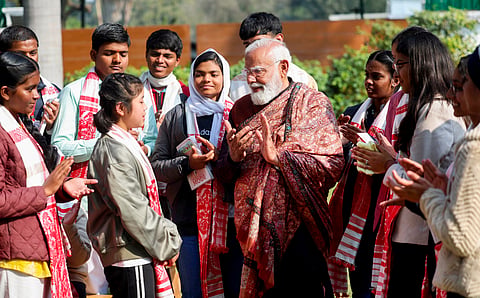 In this image released on Feb. 6, 2026, Prime Minister Narendra Modi interacts with students during the ninth edition of 'Pariksha Pe Charcha 2026 with PM' at his residence, in New Delhi.