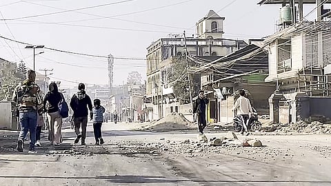 People travel as normal activity resumes after the violence broke out between security forces and the mob against the swearing-in of Manipur's new Deputy Chief Ministers, Nemcha Kipgen and Losii Dikho, in Churachandpur on Friday.
