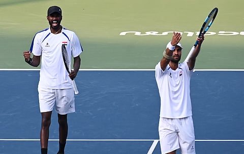 Yuki Bhambri (R) and Dhakshineswar Suresh celebrate their doubles win on Sunday