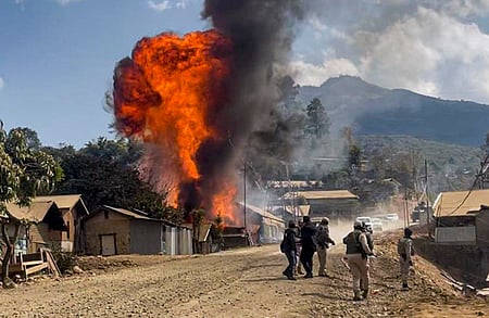 Smoke and flames billow after armed miscreants allegedly set fire to houses, at Litan Sareikhong village, in Ukhrul district of Manipur,.