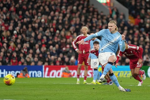 Manchester City's Erling Haaland scores from a penalty kick during the EPL soccer match between Liverpool and Manchester City in Liverpool, England, Sunday, Feb. 8, 2026.
