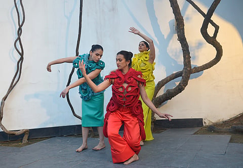 Dancers in Lee's wearable work at the 'Dreaming in Thread' event in Delhi