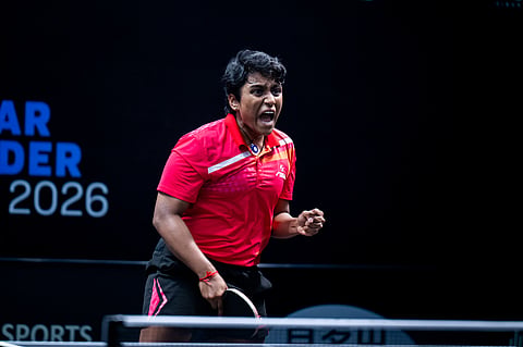 Nithya Mani celebrates a point on Friday