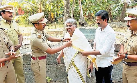 Motor vehicle department officials honouring Prabhavathy Amma on Friday