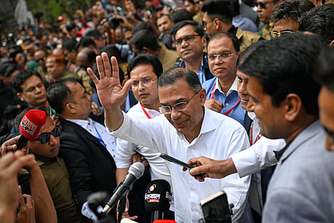 Bangladesh Nationalist Party Chairperson Tarique Rahman waves as he comes out after casting his vote during the national parliamentary elections in Dhaka, Bangladesh, Thursday, Feb. 12, 2026.