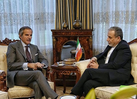 In this photo released by the Iranian Foreign Ministry, Iranian Foreign Minister Abbas Araghchi, right, and International Atomic Energy Agency (IAEA) Director-General Rafael Grossi, left, hold a meeting in Geneva, Switzerland, Monday, Feb. 16, 2026.