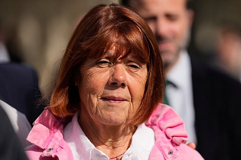 Gisele Pelicot leaves the courthouse for a break during the appeals trial in the case of a man challenging his conviction, less than a year after the landmark verdict in a drugging and rape trial that shook France, on Oct. 9, 2025 in Nimes, southern France.