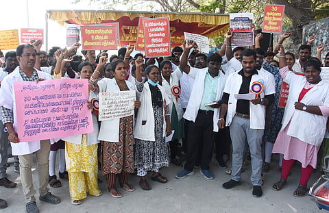 Members of Dialysis Technicians Association stage a protest at Sivanandha Salai near Omandurar Multi Super Speciality Hospital in Chennai on Wednesday.