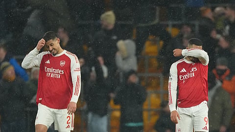 Arsenal's Gabriel Jesus and William Saliba react during the Premier League soccer match between Wolverhampton Wanderers and Arsenal in Wolverhampton, England, Wednesday, Feb. 18, 2026.