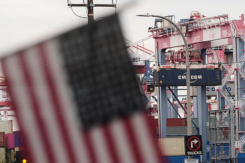 A US flag flies at the Port of Long Beach on Friday, Feb. 20, 2026, in Long Beach, Calif.