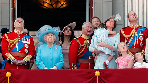 From left, Britain's Prince Andrew, Queen Elizabeth, Meghan Duchess of Sussex, Prince Charles, Prince Harry, Kate Duchess of Cambridge, and Prince William attend the annual Trooping the Colour Ceremony in London, Saturday, June 9, 2018.