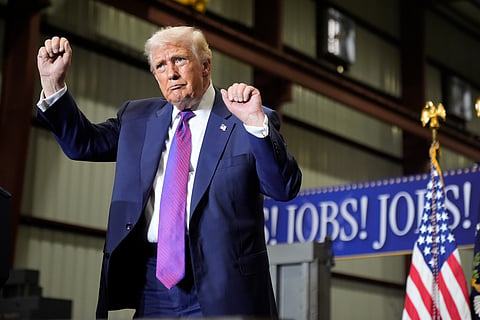 President Donald Trump dances after speaking at a rally at Coosa Steel Corporation in Rome, Ga., Thursday, Feb. 19, 2026.