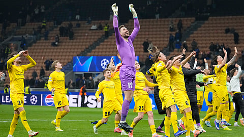 Glimt's players celebrate at the end of the Champions League playoff soccer match between Inter Milan and Bodo Glimt, at the San Siro stadium in Milan, Italy, Tuesday, Feb.24, 2026.