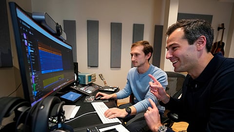 Mikey Shulman, one of the founders of AI music generator startup Suno, right, and research scientist Christian Steinmetz, collaborate on creating a song, Tuesday, Jan. 13, 2026, in Cambridge, Mass.
