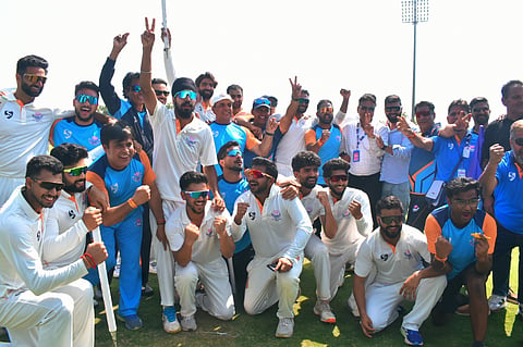 Krishna Kumar (centre) celebrates with Jammu and Kashmir team