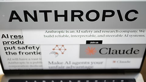 Pages from the Anthropic website and the company's logos are displayed on a computer screen in New York on Thursday, Feb. 26, 2026.