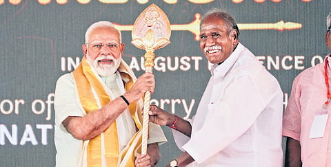 Chief Minister N Rangasamy presenting a silver vel (spear) to Prime Minister Narendra Modi during an event in Puducherry on Sunday