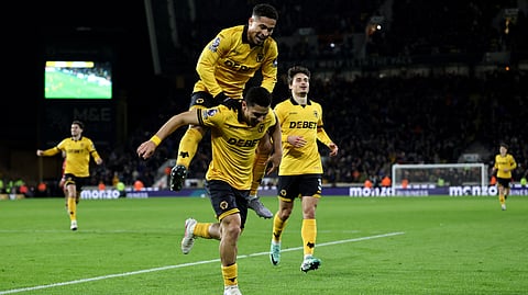 Wolverhampton Wanderers' Andre celebrates scoring the team's second goal with teammate Wolverhampton Wanderers' Brazilian midfielder during the EPL football match between Wolverhampton Wanderers and Liverpool on March 3, 2026.