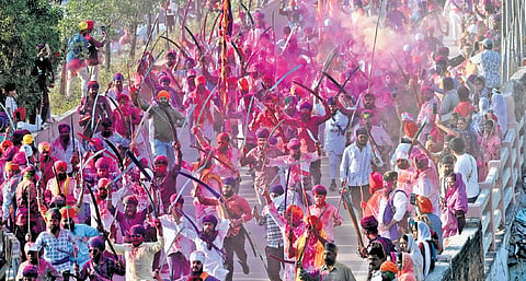 Members of the Sikh community perform Halla Bol as part of a procession in Hyderabad on Wednesday