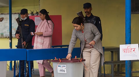 A woman casts her vote at a polling station for the parliamentary election in Kathmandu, Nepal, Thursday, March 5, 2026.