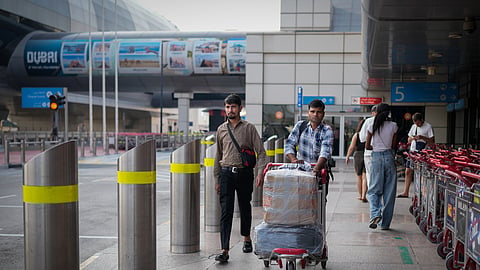 Passengers arrive at Dubai International Airport terminal as the airport resumes limited operations in Dubai, United Arab Emirates, Thursday, March 5, 2026.