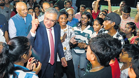 Chief Election Commissioner Gyanesh Kumar interacting with children during a visit to Marine Drive in Kochi on Friday.