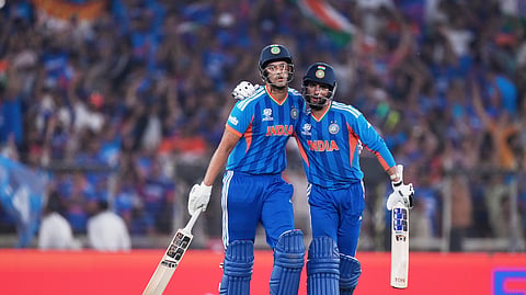 India's Shivam Dube, left, and batting partner Tilak Varma celebrate after a good last over of India's batting inning during the T20 World Cup cricket final match between India and New Zealand in Ahmedabad, India, Sunday, March 8, 2026.