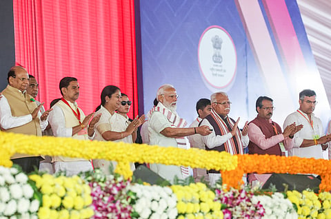 Prime Minister Narendra Modi with Union Minister of Housing and Urban Affairs Manohar Lal and Delhi CM Rekha Gupta during the inauguration and foundation stone laying ceremony of multiple development works, New Delhi.
