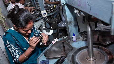 A woman working at a diamond factory, based in Jeram Morar Ni Vadi in the Katargram suburb, Surat, on Thursday, March 6, 2026.