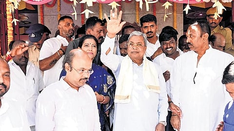 Chief Minister Siddaramaiah, MLC Yathindra and others during the temple event at Pillahalli village in Mysuru on Saturday